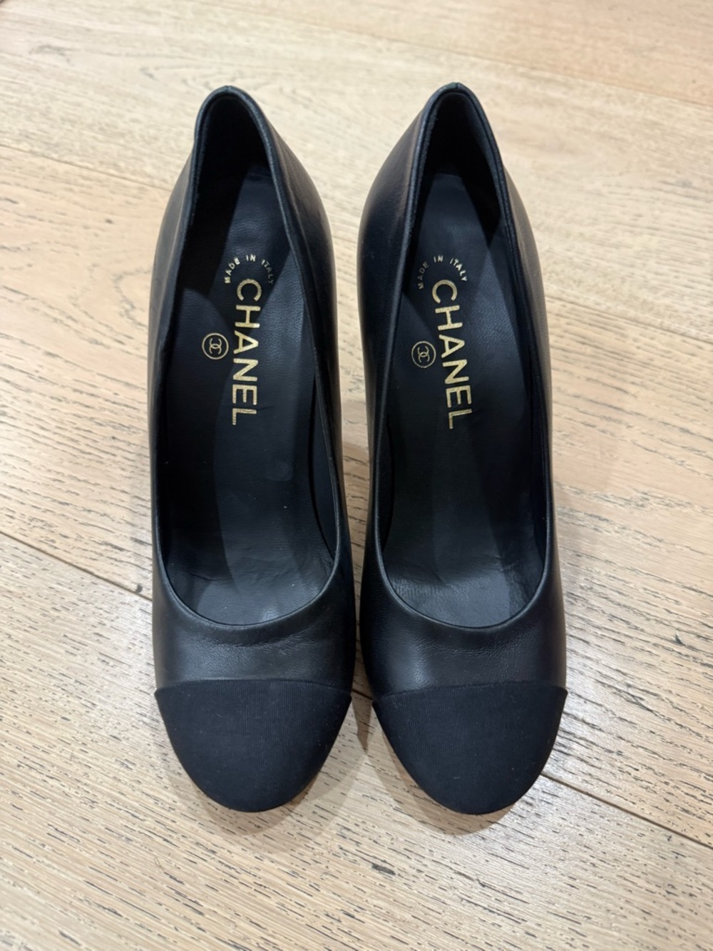 CHANEL Black Leather and Fabric Cap-Toe Pumps